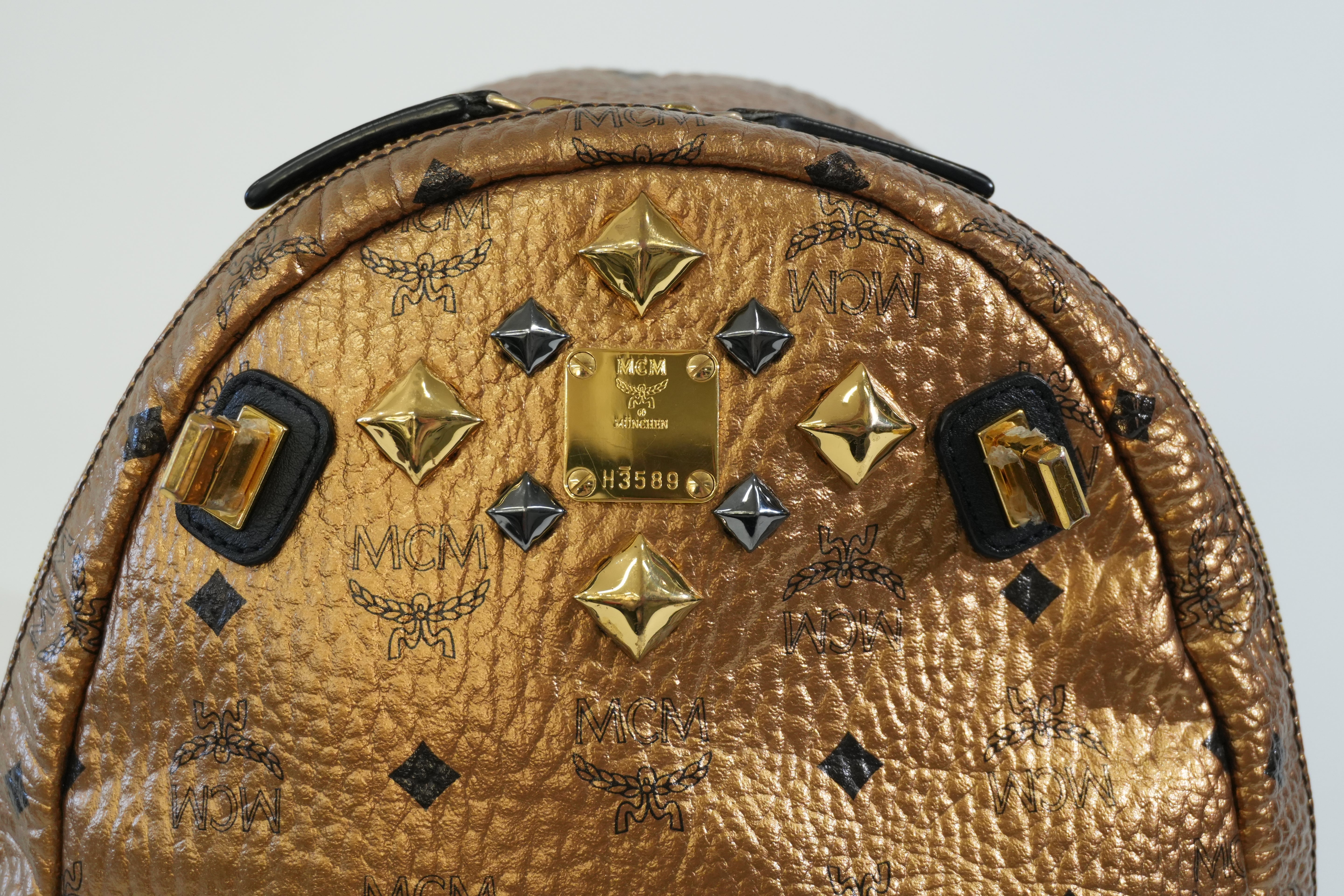 Pre-owned MCM Metallic Backpack with Detachable Pouch Gold