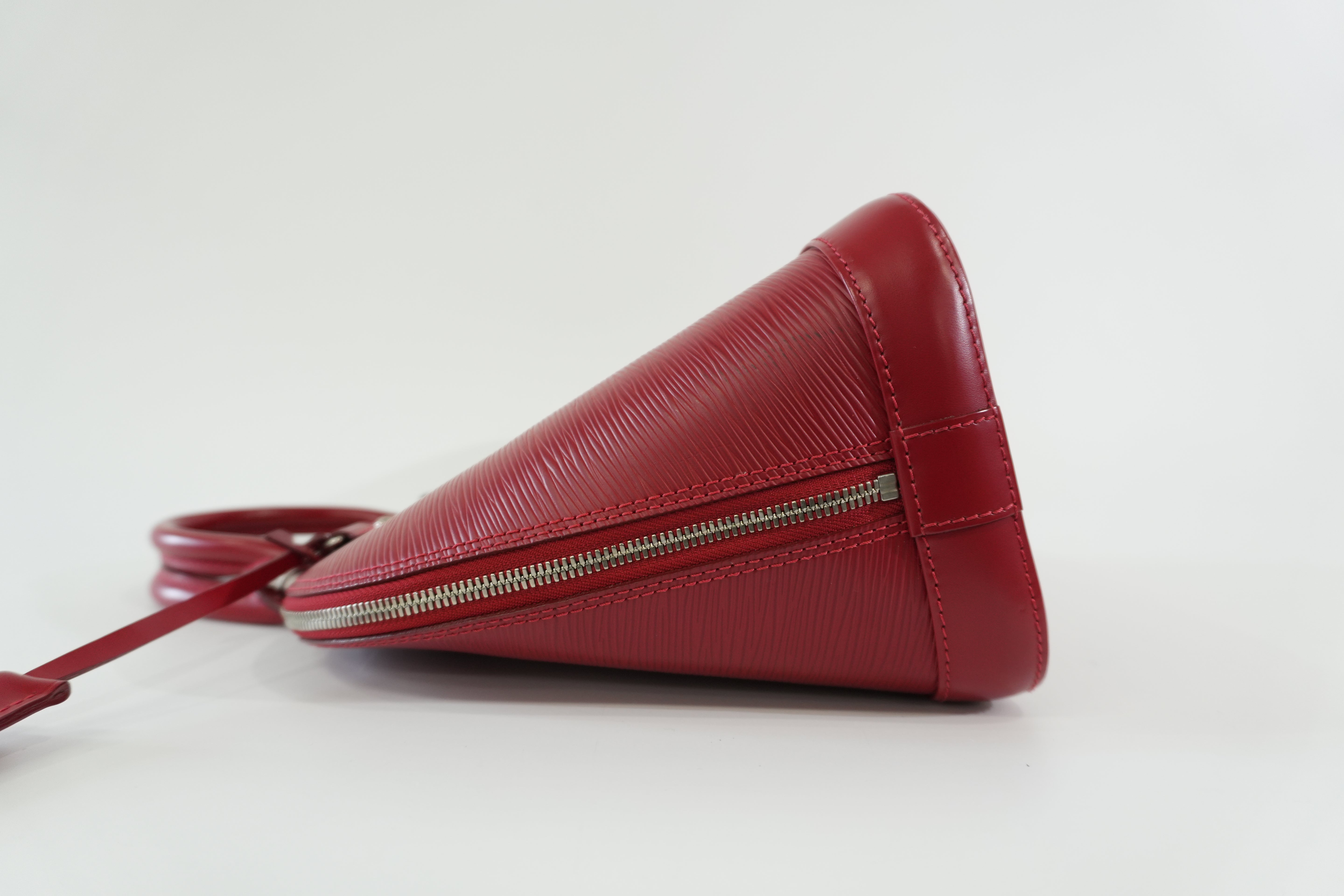 Pre-owned Louis Vuitton Epi Alma PM Handbag Red