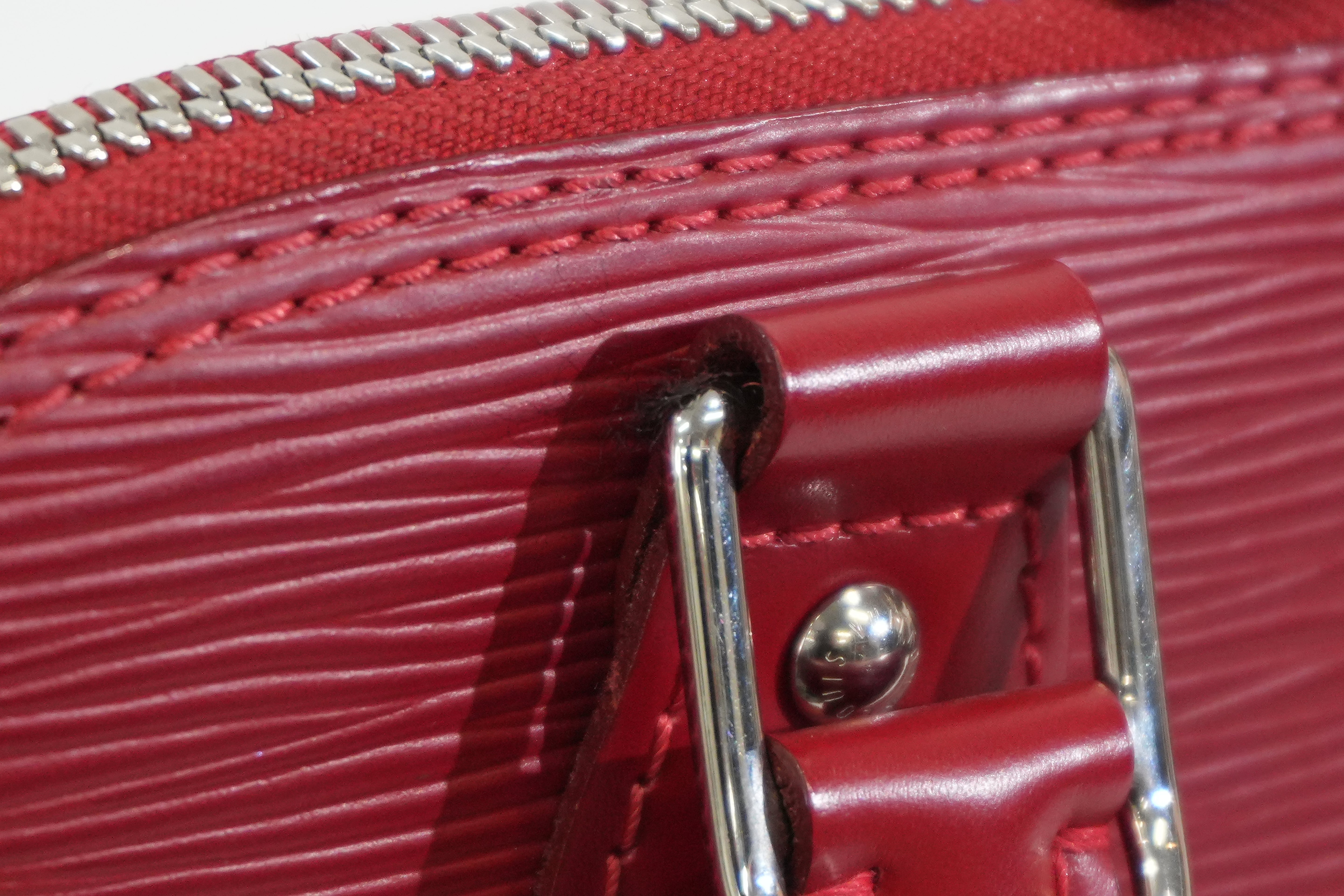 Pre-owned Louis Vuitton Epi Alma PM Handbag Red